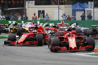 Kimi Raikkonen, Ferrari SF71H, leads Sebastian Vettel, Ferrari SF71H, Lewis Hamilton, Mercedes AMG F1 W09, and the rest of the field at the start
