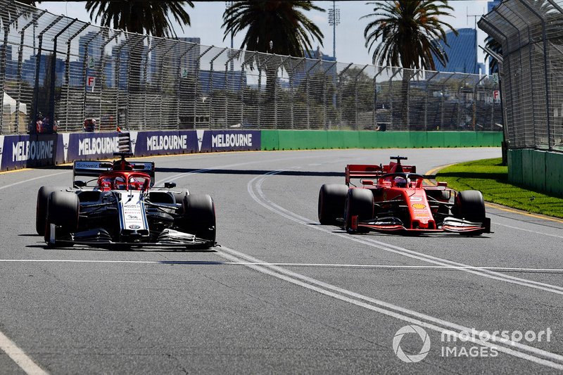 Sebastian Vettel, Ferrari SF90, passes Kimi Raikkonen, Alfa Romeo Racing C38