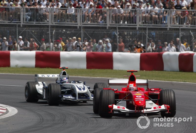 Michael Schumacher, Ferrari F2004 leads Juan Pablo Montoya, Williams BMW FW26