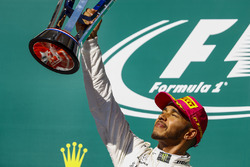 Race winner Lewis Hamilton, Mercedes AMG F1, lifts his trophy