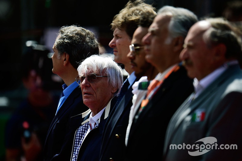 Bernie Ecclestone, as the grid observes the national anthem