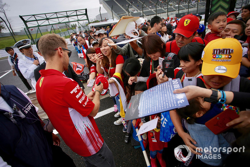 Sebastian Vettel, Ferrari signs autographs for fans