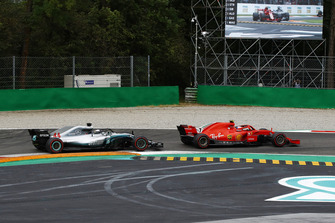 Kimi Raikkonen, Ferrari SF71H leads Lewis Hamilton, Mercedes AMG F1 W09