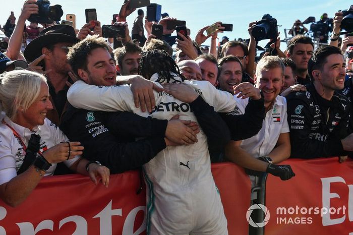 Lewis Hamilton, Mercedes AMG F1, 2nd position, celebrates in Parc Ferme with his team, friends and family after securing the world drivers championship title for a sixth time