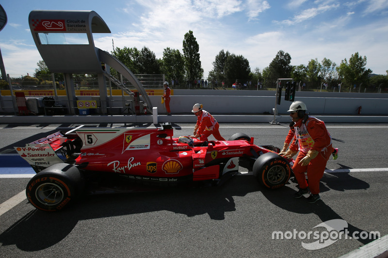 Sebastian Vettel, Ferrari SF70H, gets a push back from some marshals