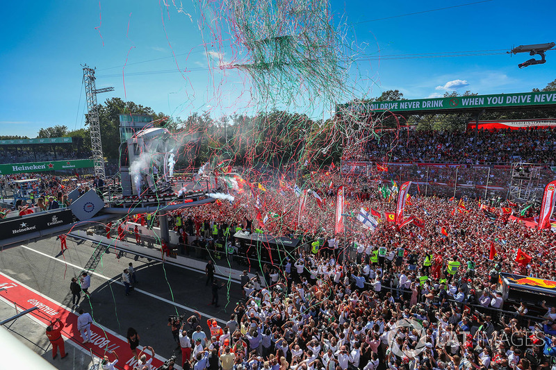 Sebastian Vettel, Ferrari, Lewis Hamilton, Mercedes AMG F1 and Valtteri Bottas, Mercedes AMG F1 celebrate on the podium and Ferrari Fans and flags at the podium celebrations