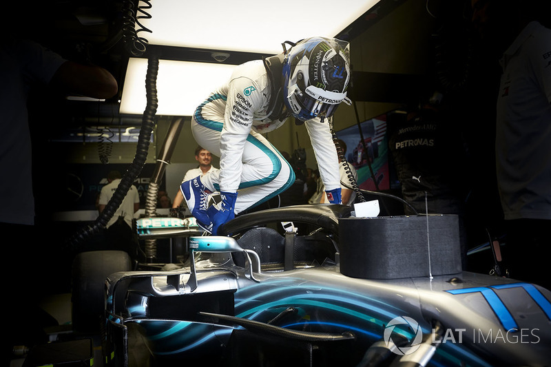 Valtteri Bottas, Mercedes AMG F1, climbs in to his car