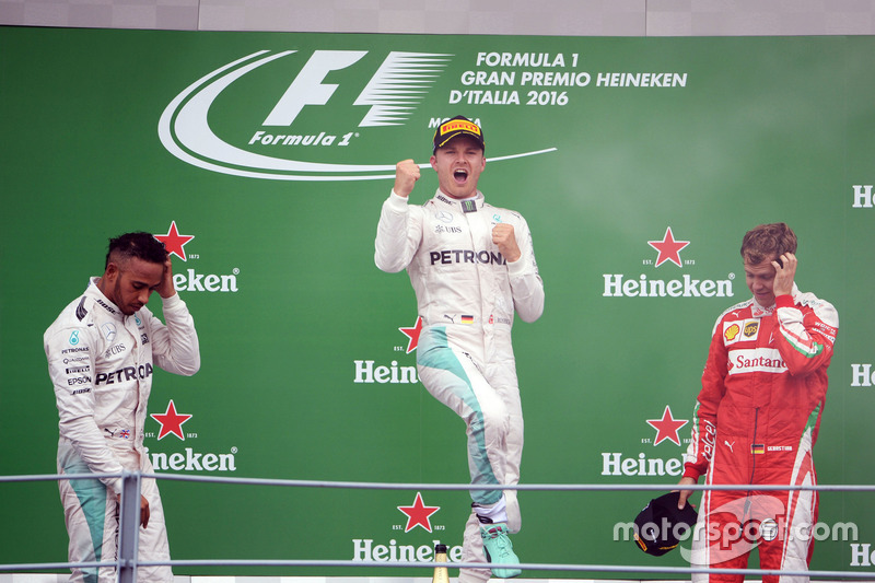 The podium (L to R): second place Lewis Hamilton, Mercedes AMG F1; Race winner Nico Rosberg, Mercede