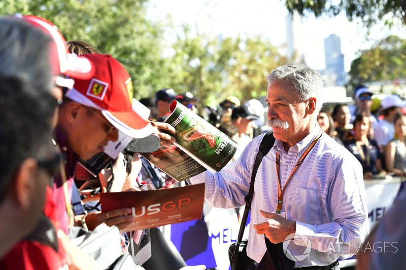 Chase Carey, Chief Executive Officer and Executive Chairman of the Formula One Group signs autographs for the fans