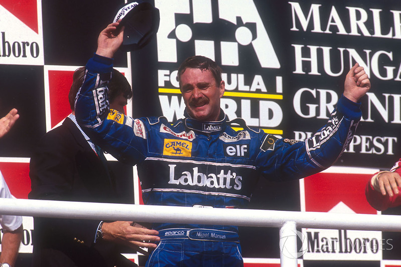 Podium: second place Nigel Mansell, Williams Renault celebrates winning the drivers World Championship