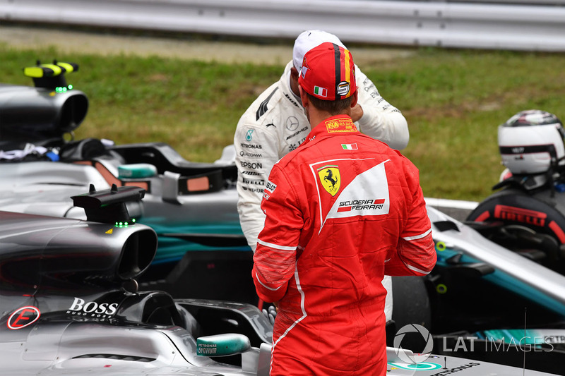Sebastian Vettel, Ferrari and Lewis Hamilton, Mercedes AMG F1 in parc ferme