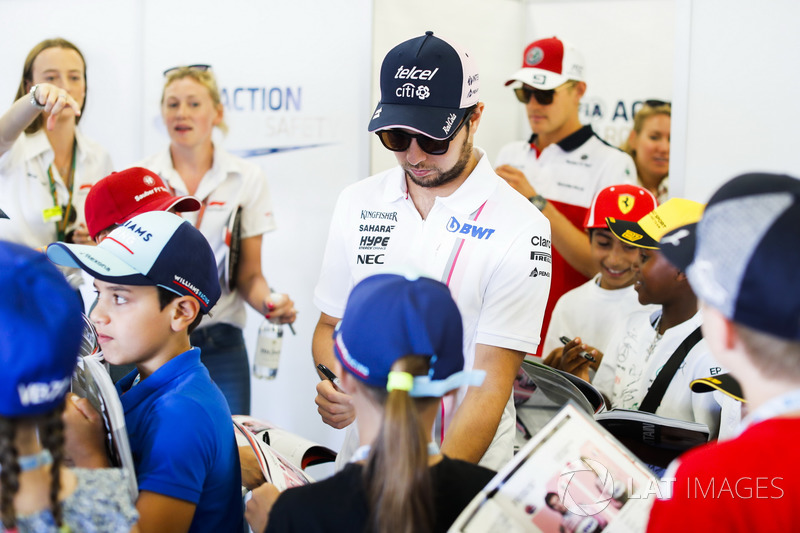 Sergio Perez, Force India, meets the grid kids