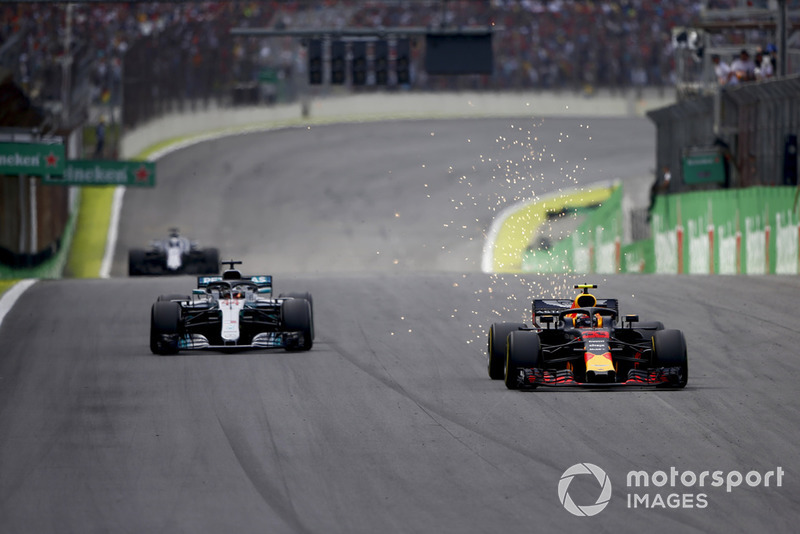 A sparking Max Verstappen, Red Bull Racing RB14, overtakes Lewis Hamilton, Mercedes AMG F1 W09. 