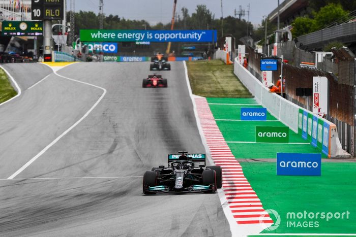 Lewis Hamilton, Mercedes W12, Charles Leclerc, Ferrari SF21, and Valtteri Bottas, Mercedes W12