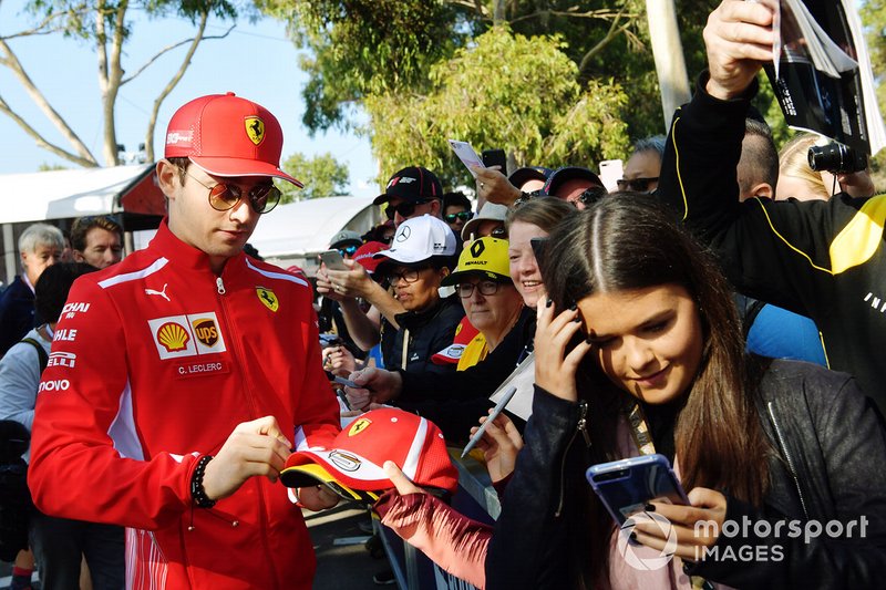 Charles Leclerc, Ferrari, signs an autograph