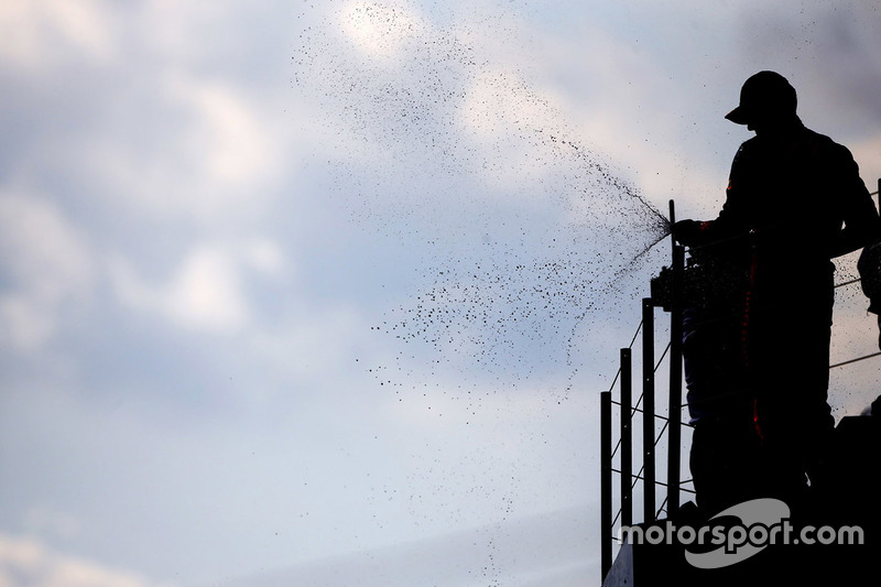 Max Verstappen, Red Bull Racing, sprays the champagne on the podium after finishing second