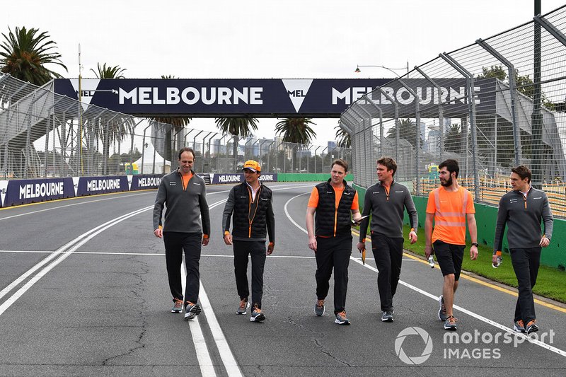 Carlos Sainz Jr., McLaren, walks the track with his team