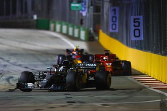 Lewis Hamilton, Mercedes AMG F1 W09 EQ Power+, leads Sebastian Vettel, Ferrari SF71H, and Max Verstappen, Red Bull Racing RB14