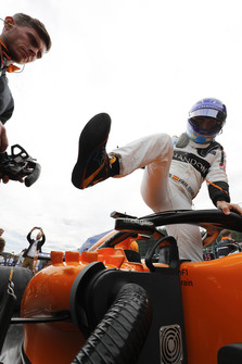 Fernando Alonso, McLaren, exits his car on the grid