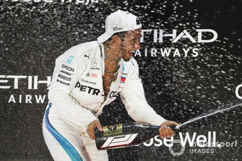 Lewis Hamilton, Mercedes AMG F1, 1st position, sprays Rose Water on the podium