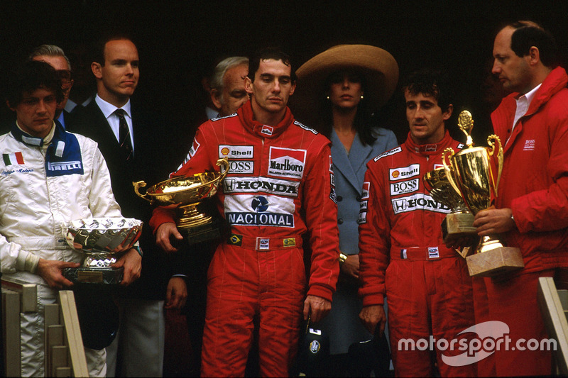 Ayrton Senna, McLaren Honda, 1st position, Alain Prost, McLaren Honda, 2nd position and Stefano Modena, Brabham BT58 Judd, 3rd position celebrate on the podium. McLaren team boss Ron Dennis on the far right