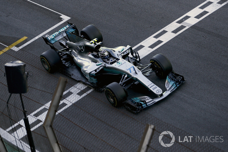 Valtteri Bottas, Mercedes-Benz F1 W08  crosses the line to take the chequered flag and Second place