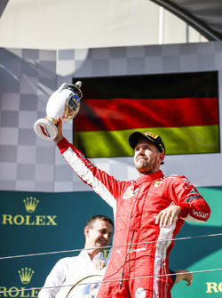 Sebastian Vettel, Ferrari, 2nd position, with his trophy on the podium