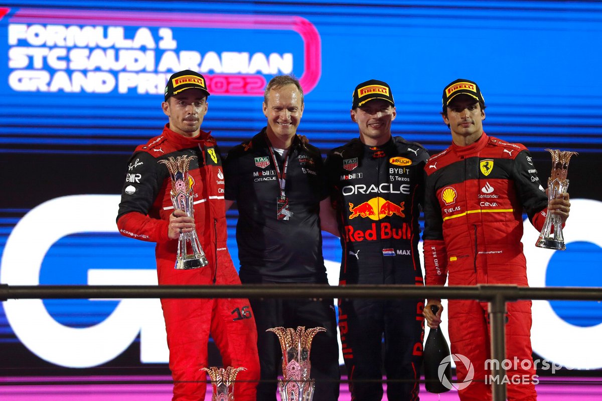 Charles Leclerc, Ferrari, 2nd position, Paul Monaghan, Chief Engineer, Red Bull Racing, Max Verstappen, Red Bull Racing, 1st position, Carlos Sainz Jr., Ferrari, 3rd position, on the podium