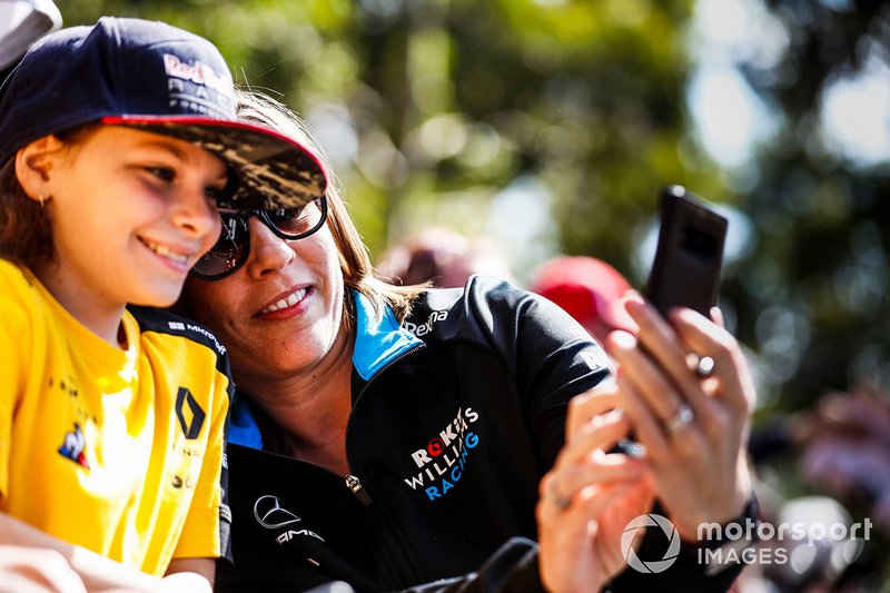 Claire Williams, Deputy Team Principal, Williams Racing poses for a selfie with a fan