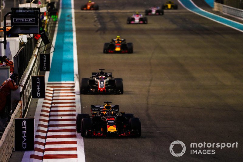 Daniel Ricciardo, Red Bull Racing RB14, leads Romain Grosjean, Haas F1 Team VF-18, and Max Verstappen, Red Bull Racing RB14