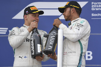 Valtteri Bottas, Mercedes AMG F1 and Lewis Hamilton, Mercedes AMG F1 with the champagne on the podium