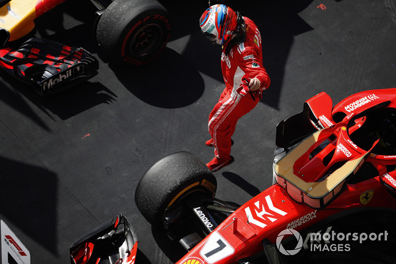 Kimi Raikkonen, Ferrari SF71H, jumps from his car as he celebrates winning the race in Parc Ferme