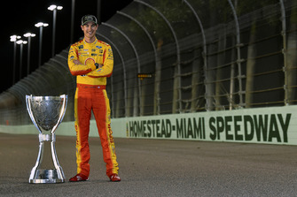 Joey Logano, Team Penske, Ford Fusion Shell Pennzoil with his Championship trophy