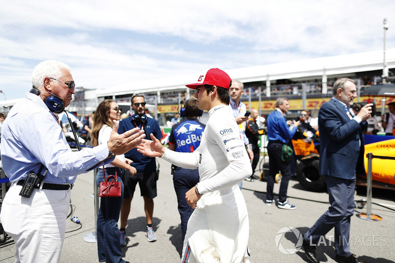 Lance Stroll, Williams Racing, greets his father Lawrence on the grid