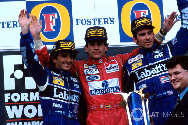 Podium: second place Alain Prost, Williams, Race winner Ayrton Senna, McLaren, third place Damon Hill, Williams