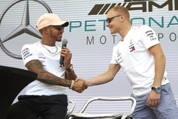 Lewis Hamilton, Mercedes AMG F1, shakes hands with Valtteri Bottas, Mercedes AMG F1, on stage