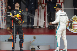 Lewis Hamilton, Mercedes AMG F1, and Race winner Daniel Ricciardo, Red Bull Racing, sprays with Champagne