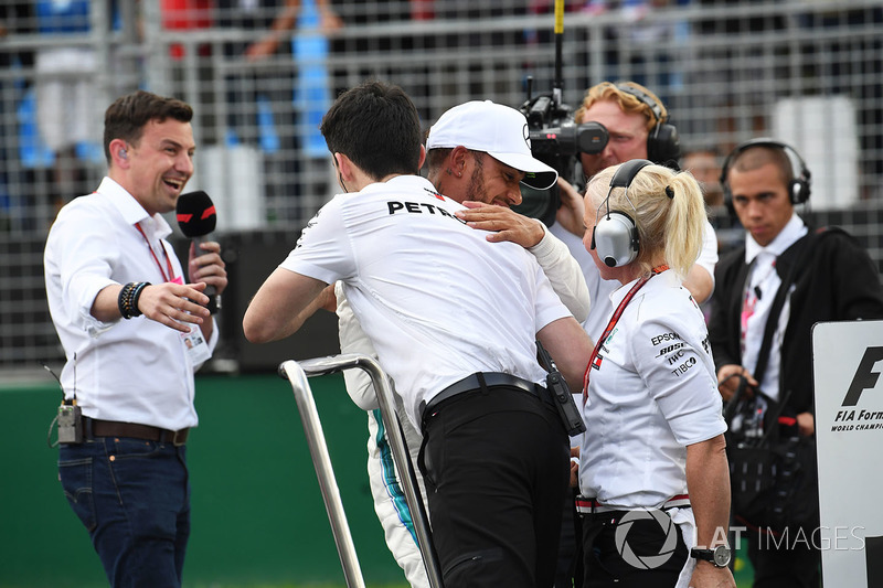 Pole sitter Lewis Hamilton, Mercedes-AMG F1 celebrates in parc ferme as Will Buxton, looks on