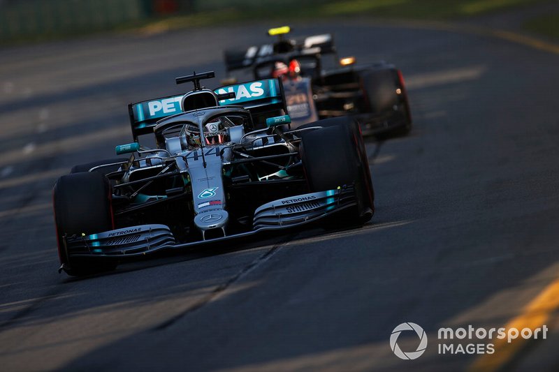 Lewis Hamilton, Mercedes AMG F1 W10, leads Kevin Magnussen, Haas F1 Team VF-19