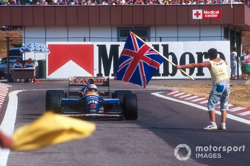 Nigel Mansell, Williams FW14B Renault, celebrates winning the drivers World Championship