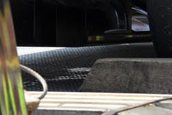 Fluid leaks from under the car of race retiree Fernando Alonso, McLaren MCL32