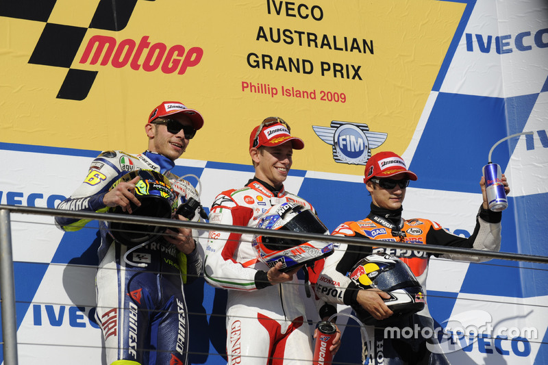 Podium: second place Valentino Rossi, Yamaha; Race winner Casey Stoner, Ducati; third place Dani Ped