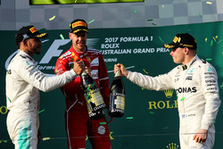 Podium: winner Sebastian Vettel, Ferrari, second place Lewis Hamilton, Mercedes AMG F1, third place Valtteri Bottas, Mercedes AMG F1