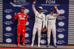 Polesitter Lewis Hamilton, Mercedes AMG F1 celebrates in parc ferme alongside Sebastian Vettel, Ferrari and Valtteri Bottas, Mercedes AMG F1