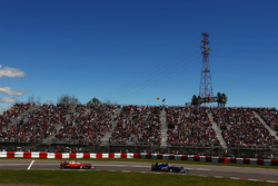 Marcus Ericsson, Sauber C35 leads Sebastian Vettel, Ferrari SF16-H