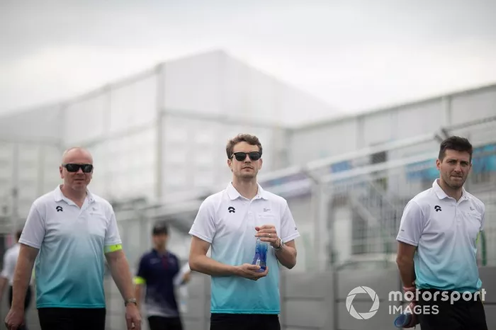 Tom Dillmann, NIO Formula E Team, walks the track with team members