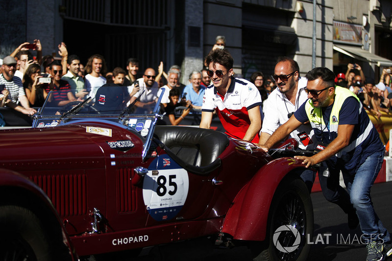 Charles Leclerc, Sauber helps push a vintage car