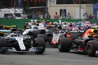 Max Verstappen, Red Bull Racing RB14, leads Valtteri Bottas, Mercedes AMG F1 W09, and Romain Grosjean, Haas F1 Team VF-18
