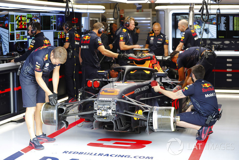 Red Bull team members work on the Daniel Ricciardo Red Bull Racing RB14