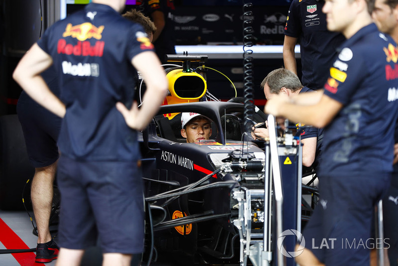 Pierre Gasly, Toro Rosso, sits in a Red Bull Racing RB14